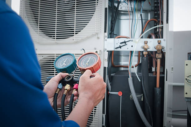 La Puente Air Repair Pros technician servicing an HVAC system in La Puente, CA